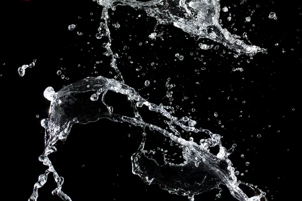 Plusk wody. na białym tle na czarnym tle — Zdjęcie stockowe