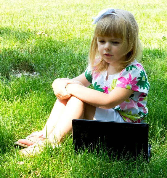 stock image Little girl with laptop