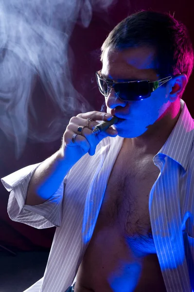 stock image Man smoking cigar