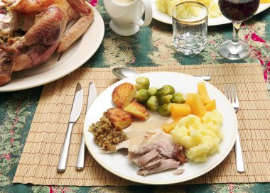 A traditional festive dinner of turkey clipart