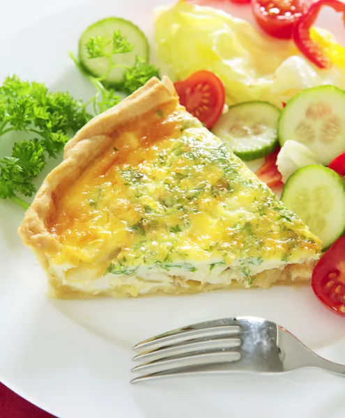A slice of homemade cheese, onion and parsley quiche — Stock Photo, Image