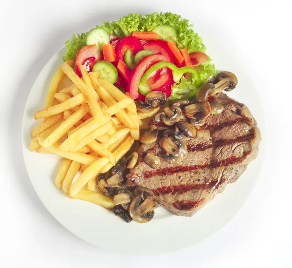 Steak and fries with salad — Stock Photo, Image