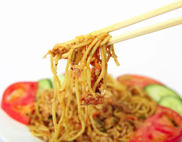 Eating noodles with chopsticks — Stock Photo, Image