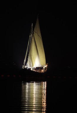 Arab dhow at night clipart