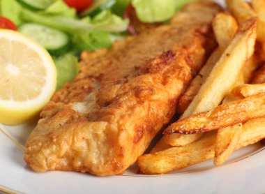 Battered fish with chips and salad clipart