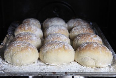 Bread rolls in the oven clipart