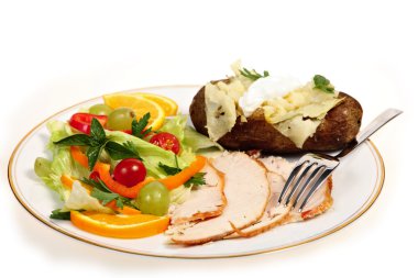 Sliced turkey and salad meal side view clipart