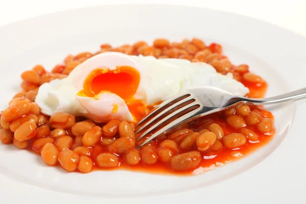 Egg and beans with fork — Stock Photo, Image