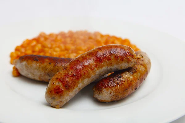 Pork sausages and beans — Stock Photo, Image