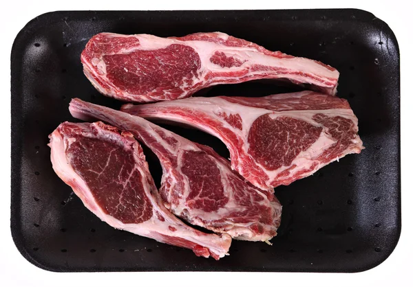 A supermarket tray of raw lamb rib chops — Stock Photo, Image