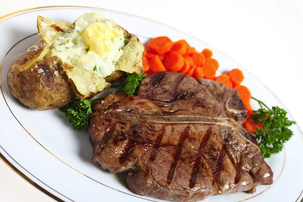 T-bone steak dinner — Stock Photo, Image