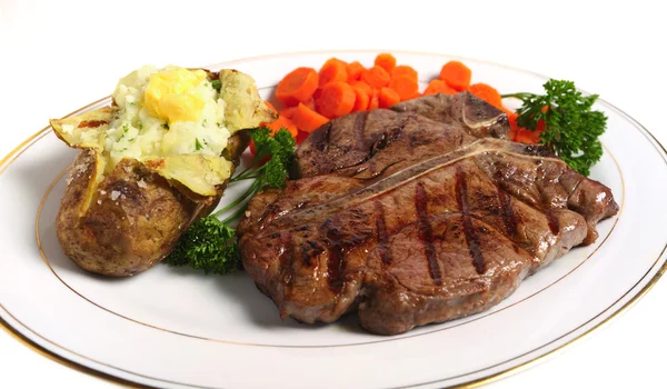 Een diner van een porterhouse steak — Stockfoto