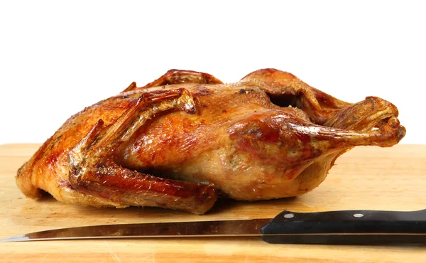 Pečená kachna a nůž — Stock fotografie
