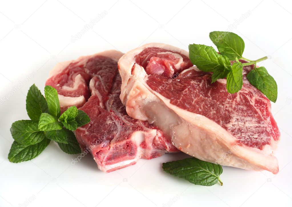 Two raw lamb chops over white