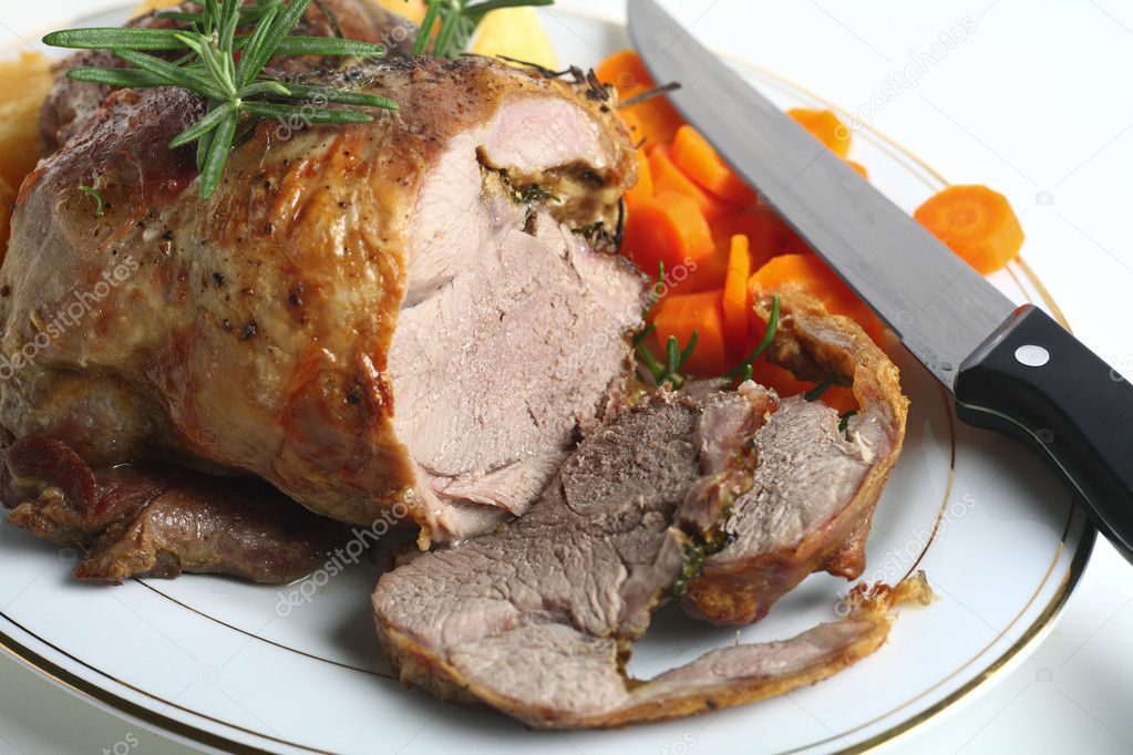 Joint of lamb with carving knife