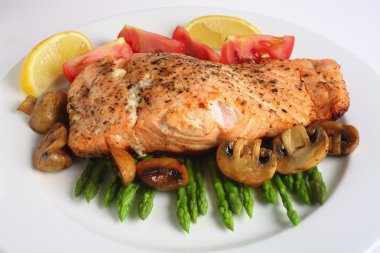 Pan fried salmon, asparagus and mushrooms clipart