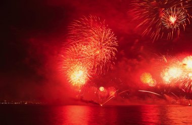 Fireworks going off over Doha Bay to mark Qatar National Day 2009 clipart