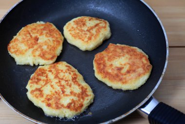 Frying potato pancakes clipart