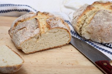 Irish soda bread on a breadboard clipart