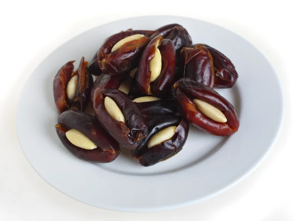 Almond stuffed dates on a plate — Stock Photo, Image
