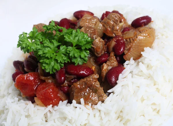 Close-up on chilli stew in a bed of rice — Stock Photo, Image