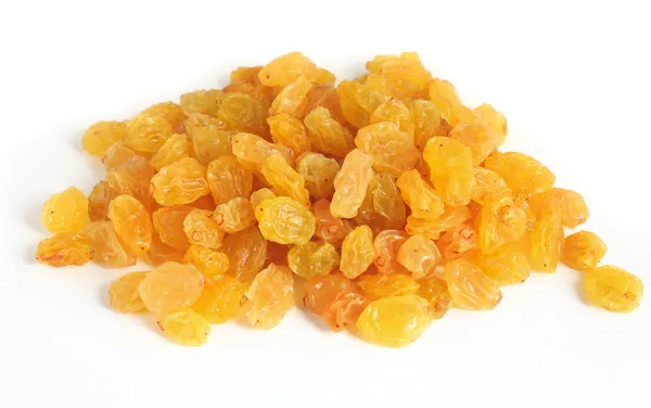Golden raisins over white — Stock Photo, Image