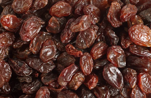 Dark raisins background — Stock Photo, Image