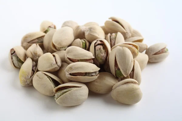 Pistachio nuts on white — Stock Photo, Image