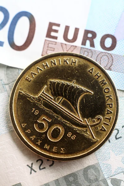 Grekiska drachmer på euro vertikala — Stockfoto