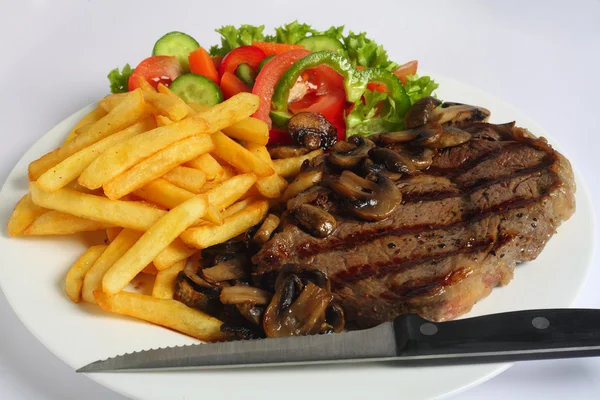Ribeye steak vacsora késsel — Stock Fotó