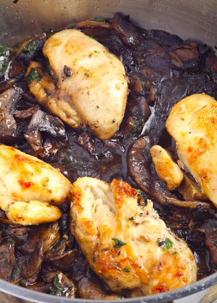 Chickens and mushrooms cooking vertical — Stock Photo, Image