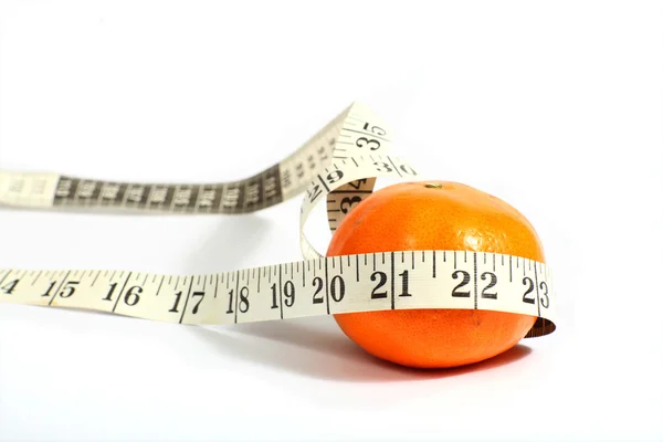 Orange with a measuring tape — Stock Photo, Image