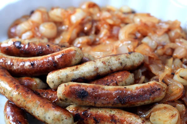 Sausages and onions — Stock Photo, Image