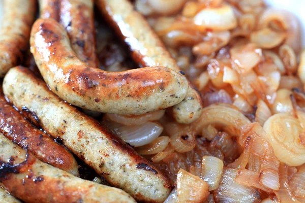 Fried sausages and onion — Stock Photo, Image