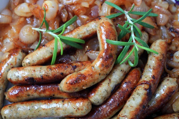 Fried sausage and onions — Stock Photo, Image