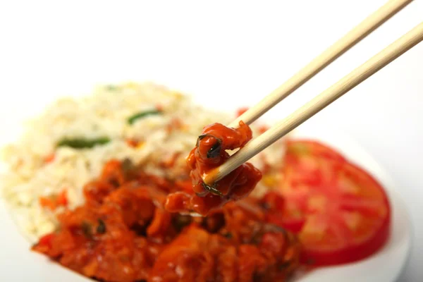 Chopsticks with chicken sweet and sour — Stock Photo, Image