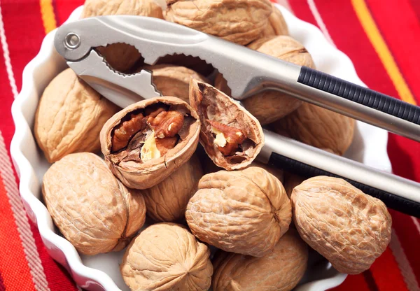 Walnuts and nutcrackers — Stock Photo, Image