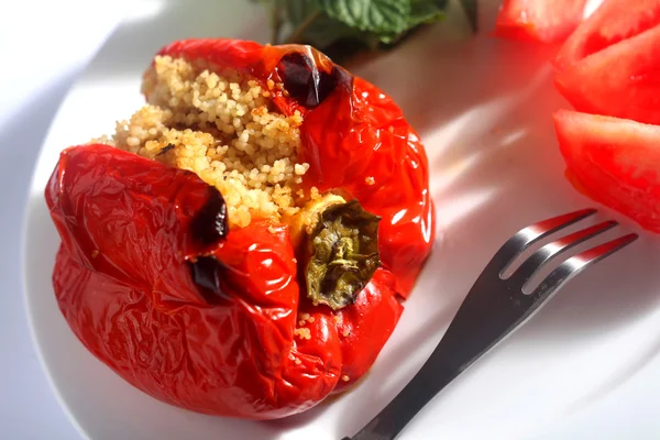 Cous-cous stuffed peppers on plate — Stock Photo, Image