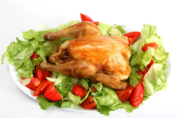 Roast chicken on a bed of salad — Stock Photo, Image