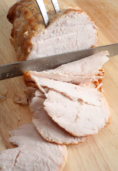 Carving boneless turkey joint — Stock Photo, Image