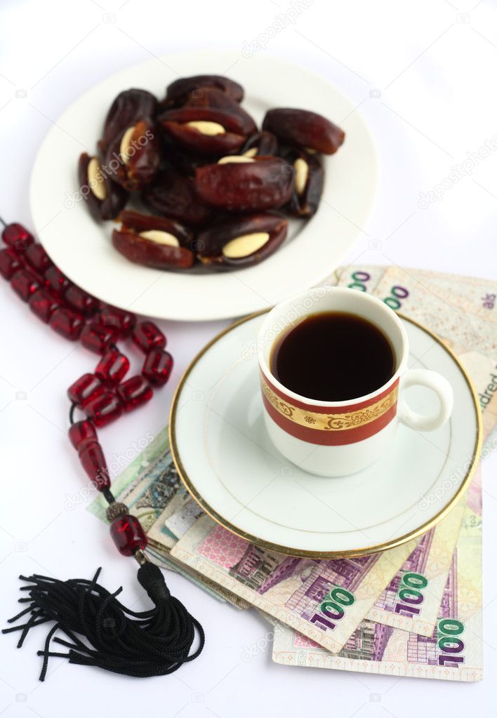 Coffee dates worry beads arab money