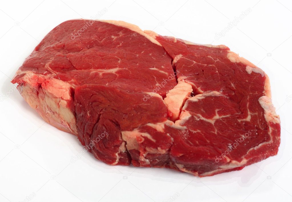Raw ribeye steak on a white background