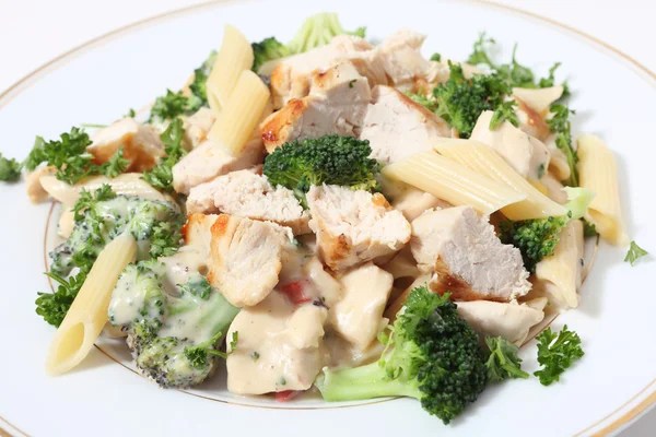 Grilled chicken broccoli and pasta in sauce — Stock Photo, Image