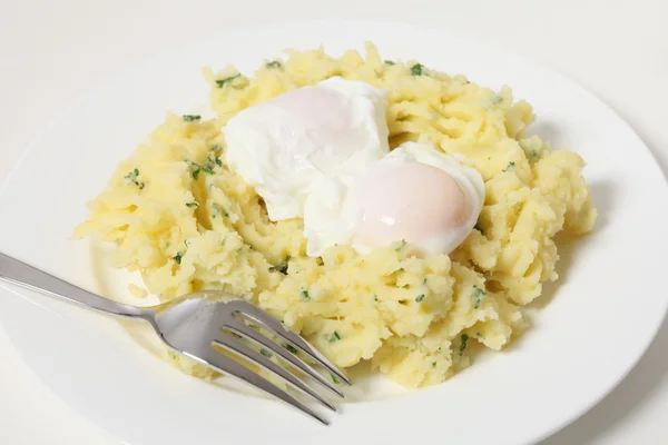 Poached eggs and potato — Stock Photo, Image
