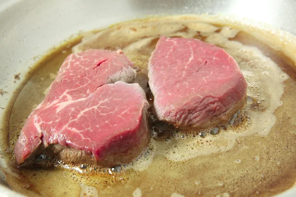 Cooking filet mignon in frying pan — Stock Photo, Image