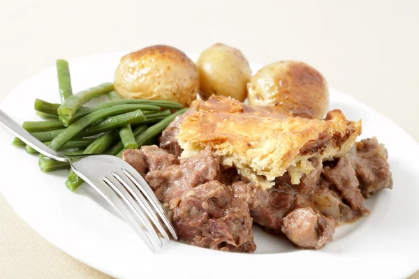 Steak and kidney pie with fork — Stock Photo, Image