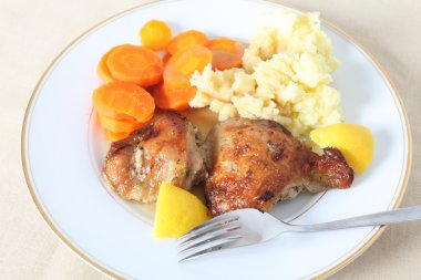 Lemon chicken meal on plate clipart