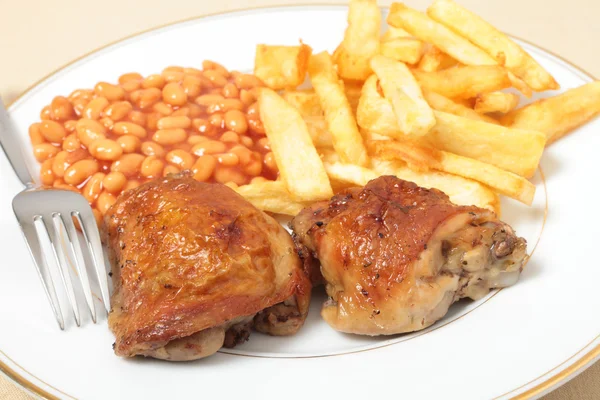 stock image Lemon chicken fries and beans meal