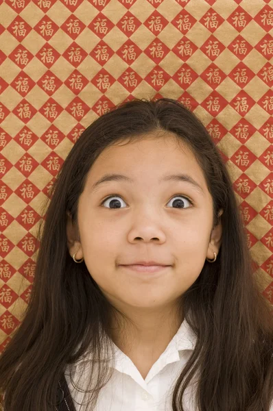 Chica asiática con mirada sorprendida — Foto de Stock
