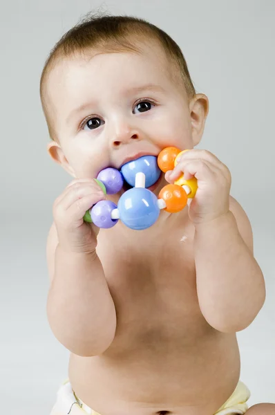 Baby met speelgoed — Stockfoto